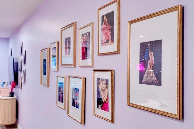 a living room with furniture a couch and a large window