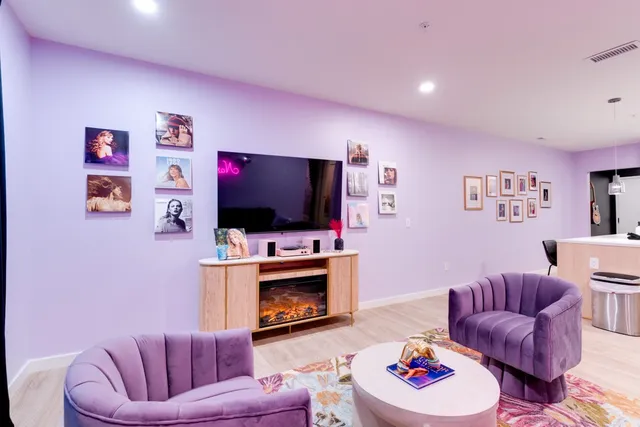 a living room with furniture and a lamp