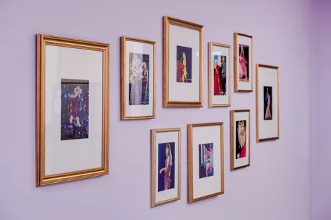 a bed sitting in a bedroom next to a lamp