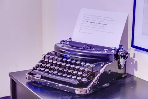 a bathroom with a sink vanity mirror and toilet