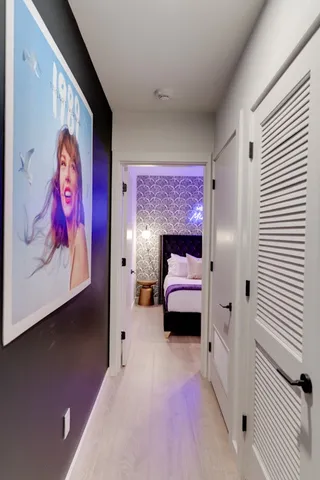a bathroom with a sink vanity mirror and toilet