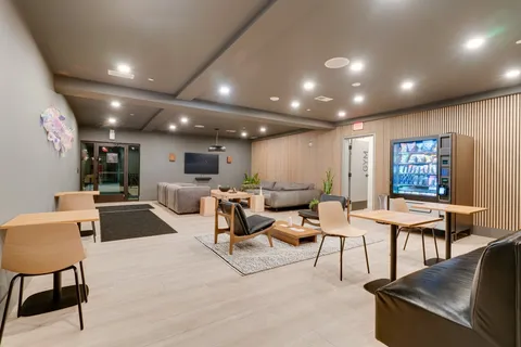 a view of an outdoor sitting area with furniture