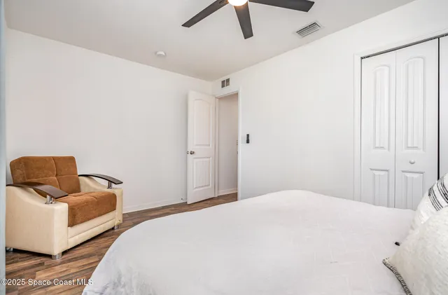 a bedroom with a bed and couch