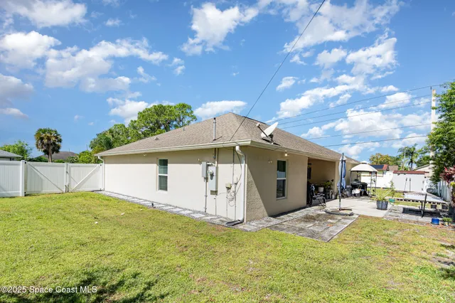 a view of a house with a yard porch and sitting area