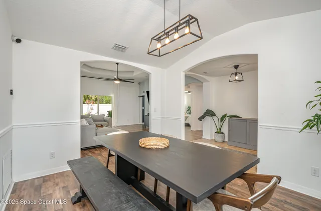 a view of a dining room and livingroom with furniture