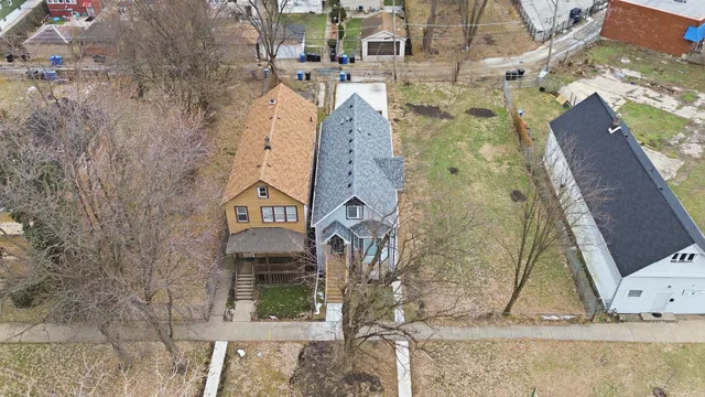 an aerial view of residential houses with outdoor space