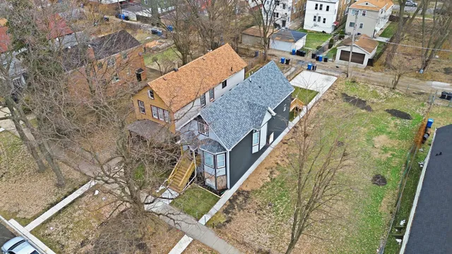 a view of a workspace with furniture and wooden floor
