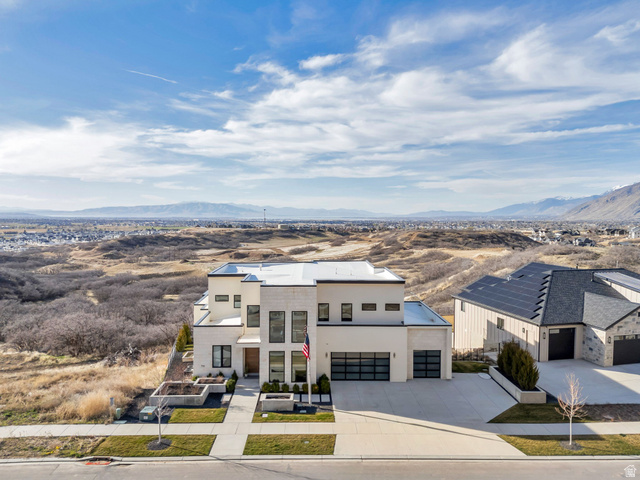 3918 South Mapleton Ests Drive Mapleton, UT 84664 - Photo 93 of 103 Modern home featuring a mountain view, concrete driveway, and stucco siding