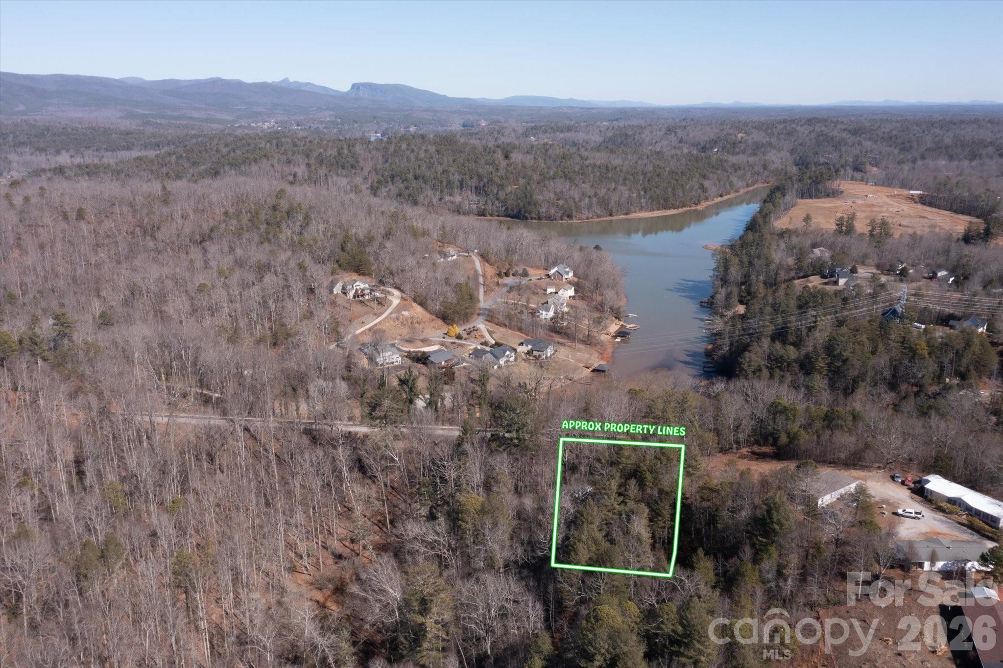 V/l V/l Ridge Walk Road, Unit 16 Marion, NC 28752 - Photo 1 of 10 an aerial view of a house with a yard