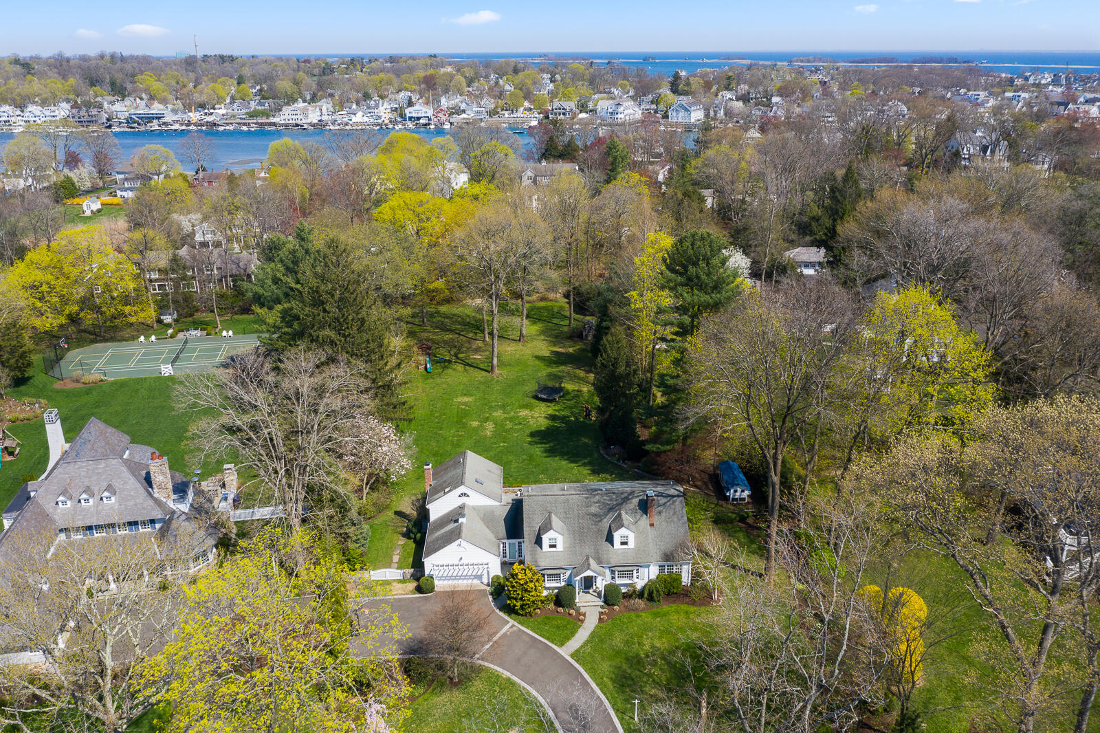 27 Searles Road Darien, CT 06820 - Photo 2 of 56 an aerial view of residential houses with outdoor space and lake view