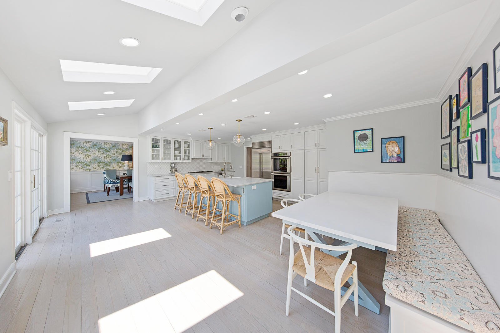 27 Searles Road Darien, CT 06820 - Photo 13 of 56 a living room with furniture a table and kitchen view
