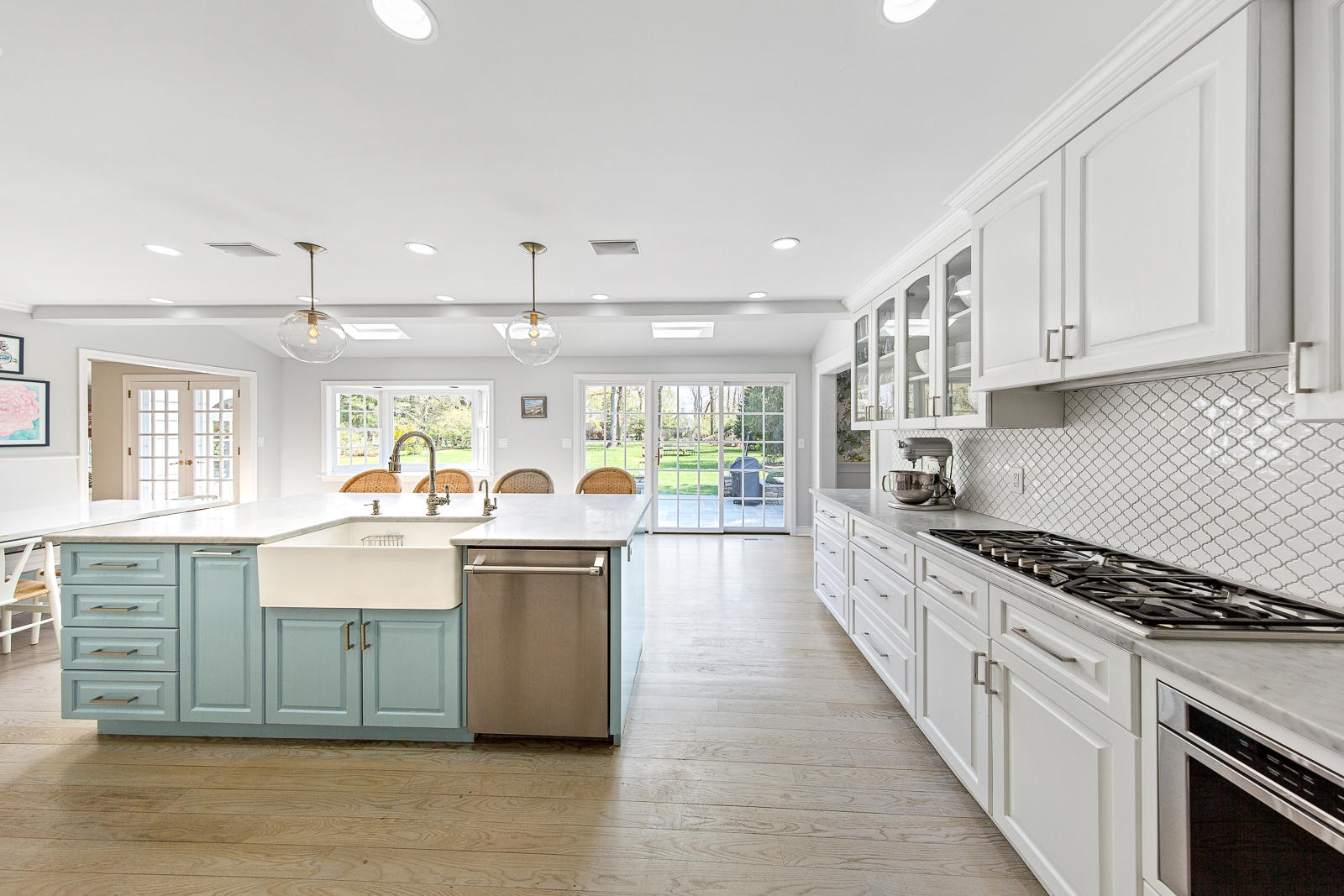 27 Searles Road Darien, CT 06820 - Photo 15 of 56 a kitchen with stainless steel appliances granite countertop a stove and cabinets