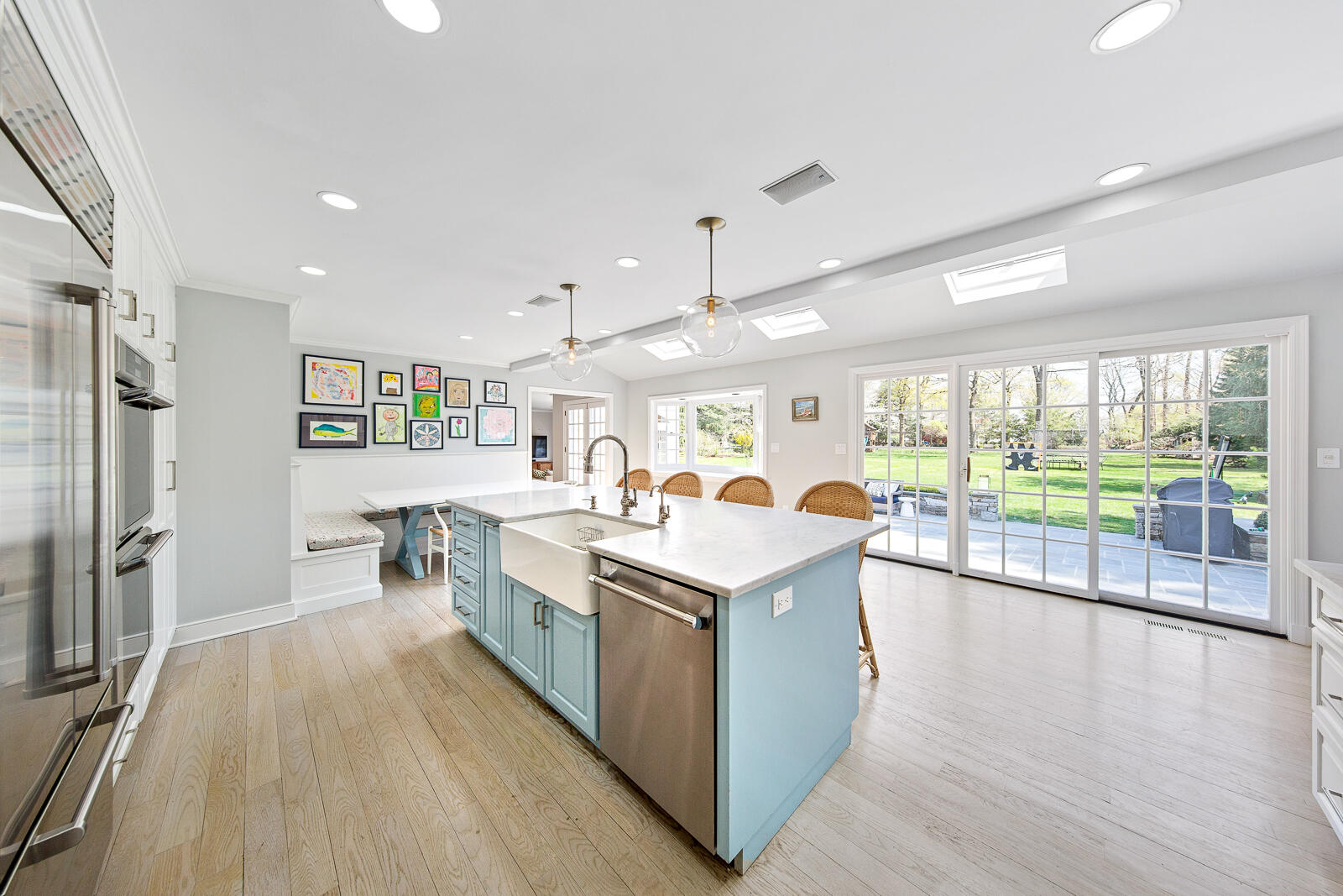 27 Searles Road Darien, CT 06820 - Photo 16 of 56 a open kitchen with stainless steel appliances granite countertop a lot of counter space and wooden floors