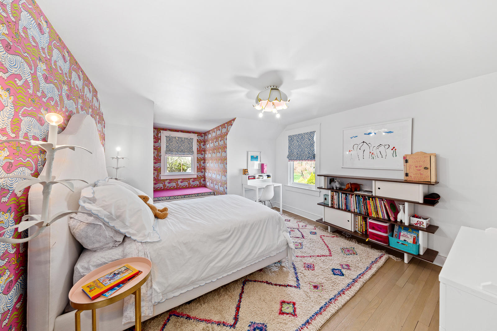 27 Searles Road Darien, CT 06820 - Photo 25 of 56 a bedroom with furniture and a chandelier