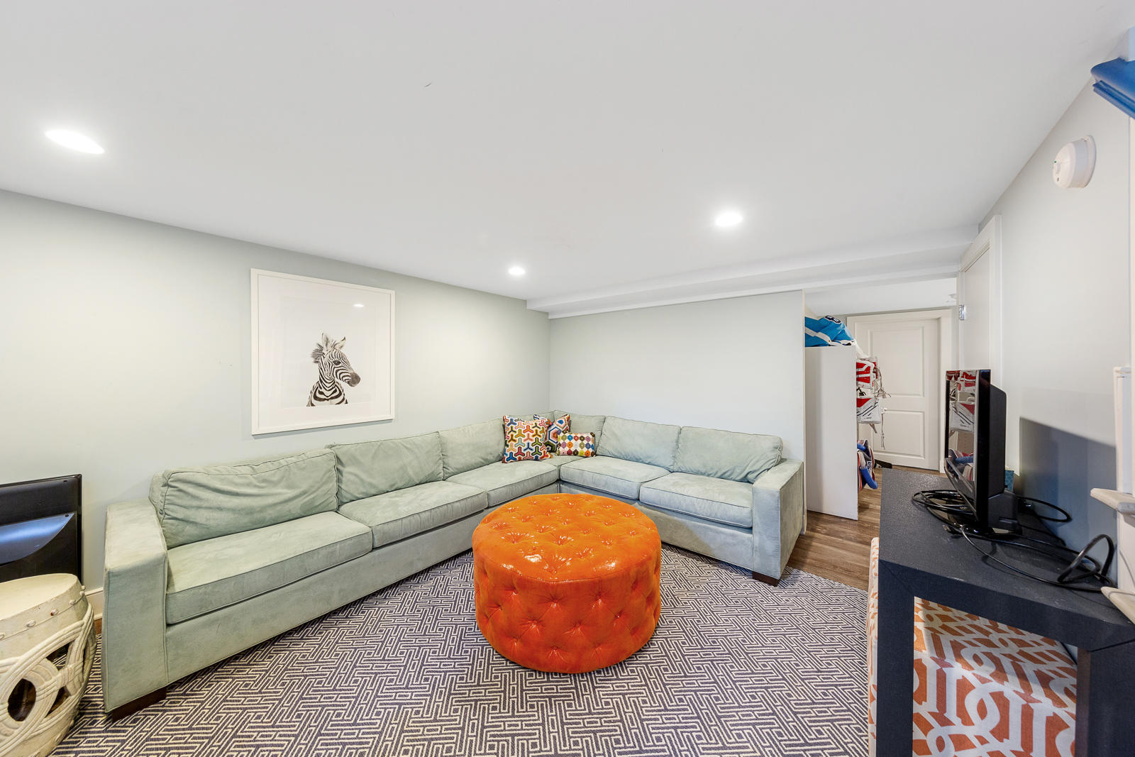 27 Searles Road Darien, CT 06820 - Photo 39 of 56 a living room with furniture and a flat screen tv