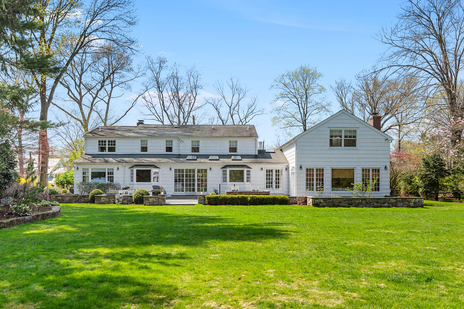 27 Searles Road Darien, CT 06820 - Photo 40 of 56 a front view of house with yard outdoor and green space