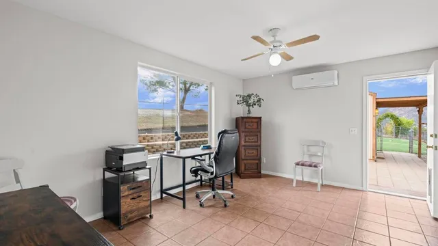 a workspace with furniture and a window