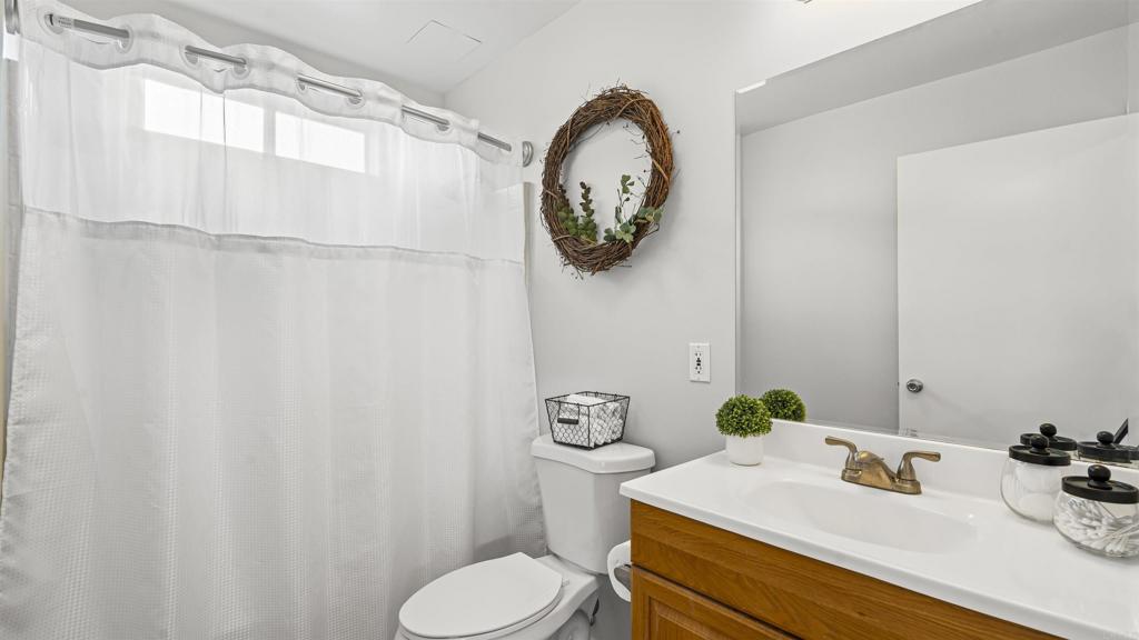 39260 Grassy Road Temecula, CA 92592 - Photo 13 of 50 a bathroom with a sink and a mirror