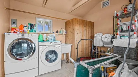 a view of livingroom with washer and dryer