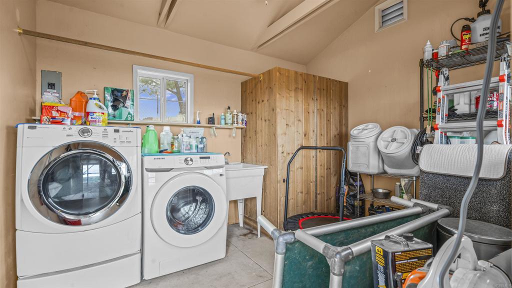 39260 Grassy Road Temecula, CA 92592 - Photo 24 of 53 a view of livingroom with washer and dryer