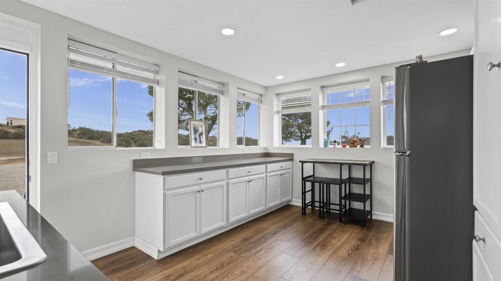 39260 Grassy Road Temecula, CA 92592 - Photo 26 of 50 a kitchen with a sink cabinets and wooden floor