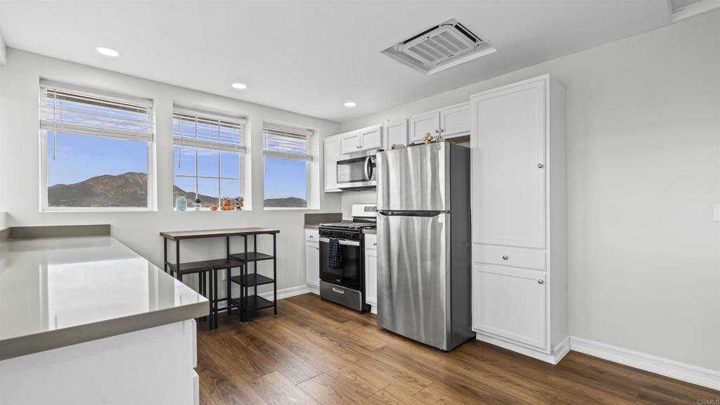 39260 Grassy Road Temecula, CA 92592 - Photo 27 of 50 a kitchen with stainless steel appliances a refrigerator and a stove