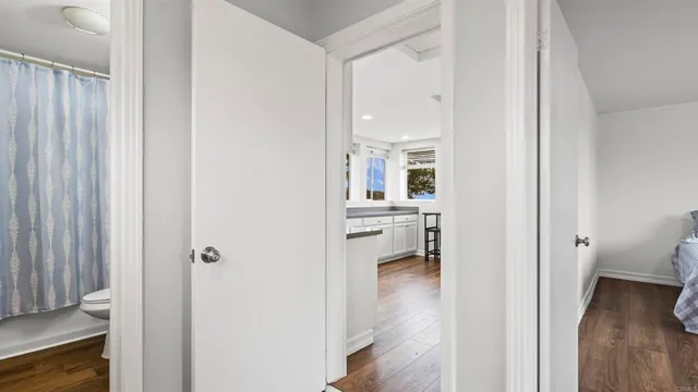 a view of a bedroom from a hallway