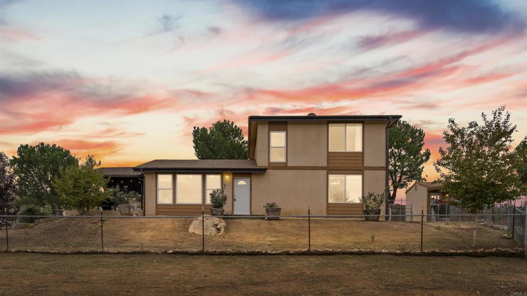 39260 Grassy Road Temecula, CA 92592 - Photo 3 of 50 a front view of a house with garden