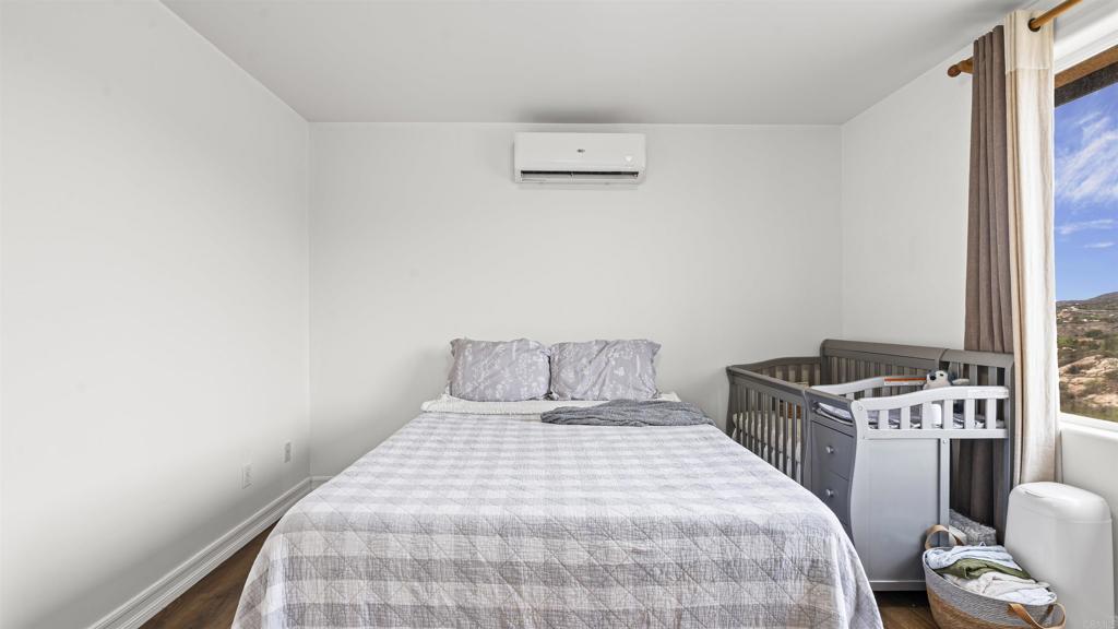 39260 Grassy Road Temecula, CA 92592 - Photo 31 of 53 a bedroom with a bed and a window