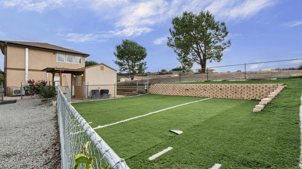 39260 Grassy Road Temecula, CA 92592 - Photo 36 of 50 a view of an house with backyard space and a tree