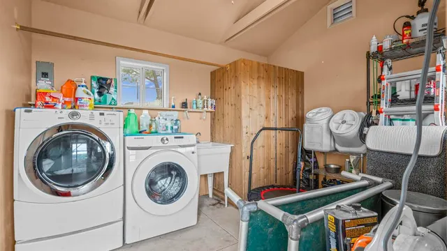 a view of livingroom with washer and dryer