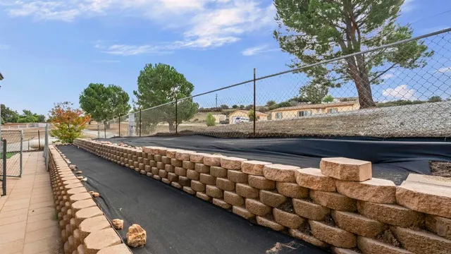 a view of a chairs and table on the balcony