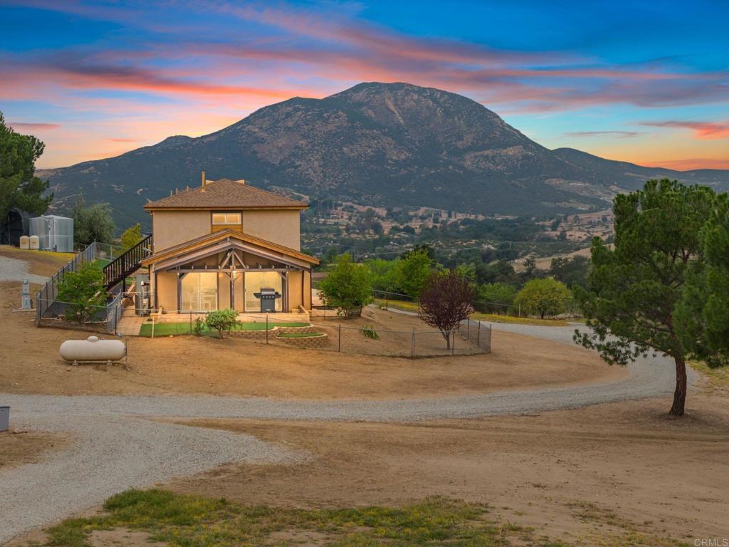 39260 Grassy Road Temecula, CA 92592 - Photo 4 of 53 a front view of a house with a yard