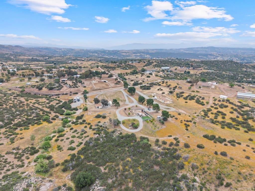 39260 Grassy Road Temecula, CA 92592 - Photo 42 of 53 an aerial view of residential building with parking space