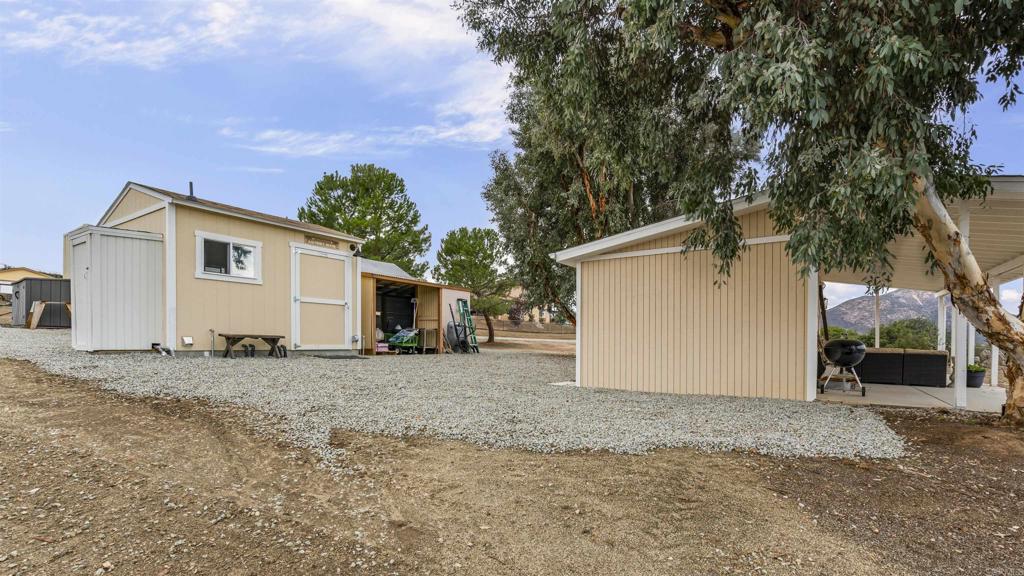 39260 Grassy Road Temecula, CA 92592 - Photo 45 of 50 a view of a house with a backyard