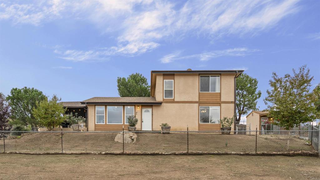 39260 Grassy Road Temecula, CA 92592 - Photo 49 of 50 front view of house with a yard