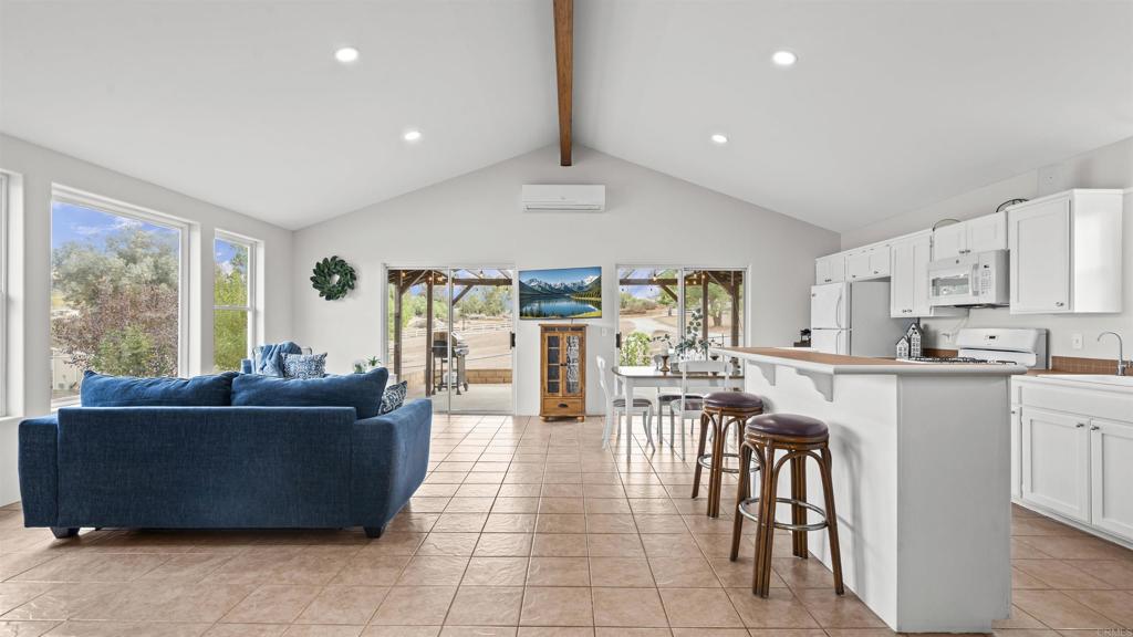 39260 Grassy Road Temecula, CA 92592 - Photo 7 of 53 a living room with furniture and a large window