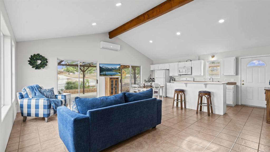 39260 Grassy Road Temecula, CA 92592 - Photo 8 of 53 a living room with furniture and a large window