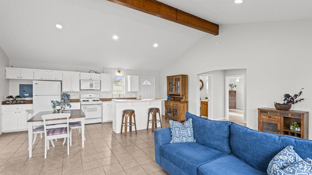 39260 Grassy Road Temecula, CA 92592 - Photo 9 of 53 a living room with furniture a dining table and chairs kitchen view with wooden floor