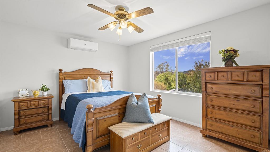 39260 Grassy Road Temecula, CA 92592 - Photo 10 of 50 a bedroom with a bed and a dresser