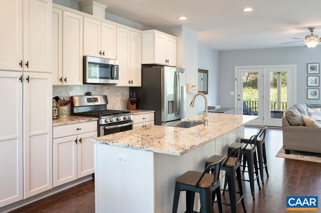 148 Junction Lane Charlottesville, VA 22902 - Photo 5 of 29 a kitchen with white cabinets and stainless steel appliances