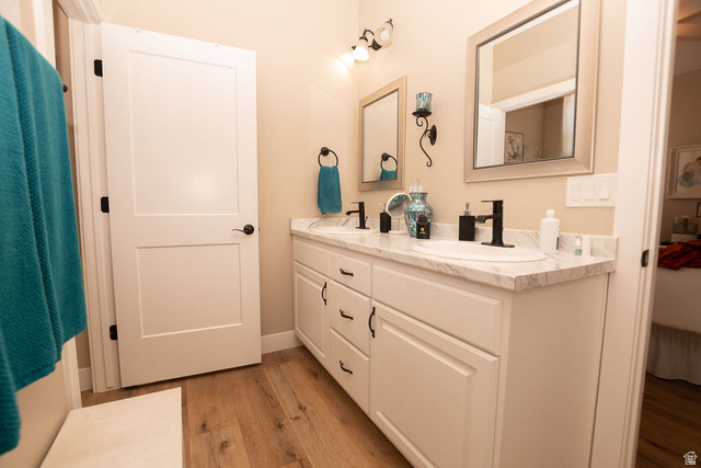 745 East 885 North Beaver, UT 84713 - Photo 30 of 50 Full bathroom with double vanity and light wood finished floors