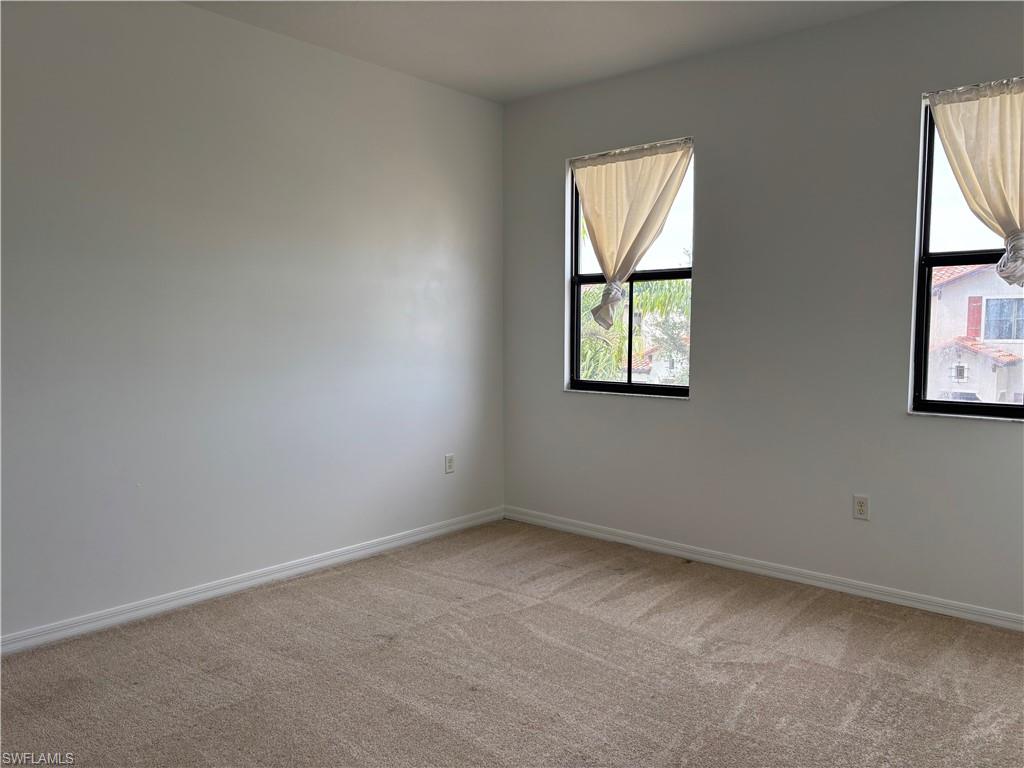 5414 Ferris Avenue Ave Maria, FL 34142 - Photo 13 of 15 Empty room with light carpet and baseboards