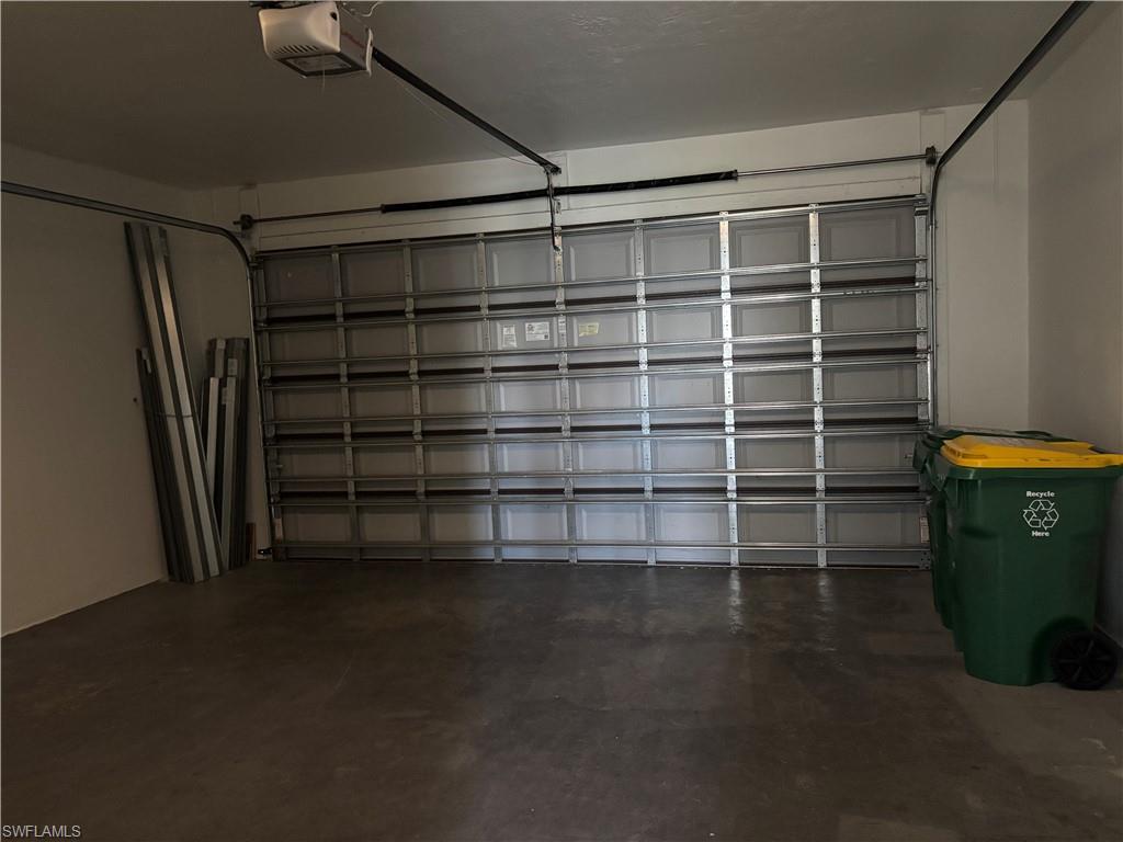 5414 Ferris Avenue Ave Maria, FL 34142 - Photo 15 of 15 Garage featuring a garage door opener