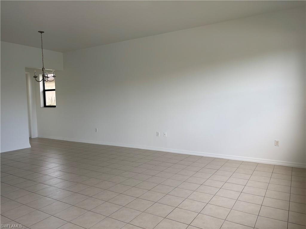 5414 Ferris Avenue Ave Maria, FL 34142 - Photo 4 of 15 Spare room featuring light tile patterned floors and baseboards
