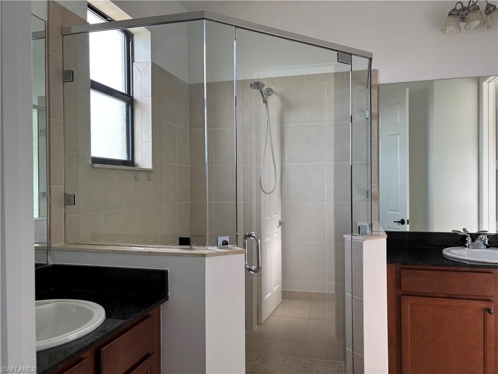 5414 Ferris Avenue Ave Maria, FL 34142 - Photo 7 of 15 Full bath with a shower stall and two vanities