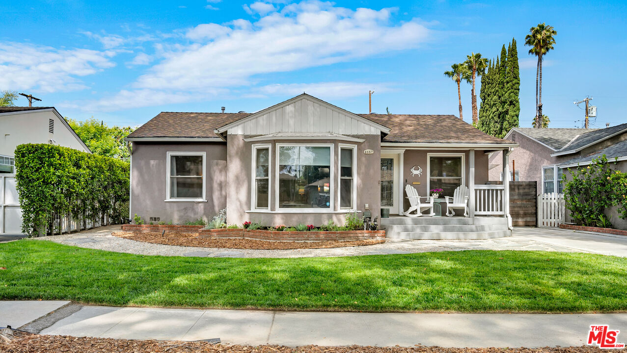 6557 Ruffner Avenue Lake Balboa, CA 91406 - Photo 1 of 31 a front view of a house with garden and porch
