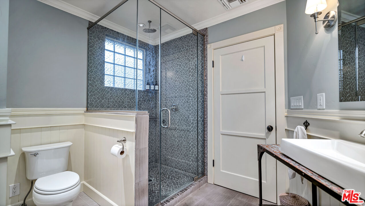 6557 Ruffner Avenue Lake Balboa, CA 91406 - Photo 12 of 31 a bathroom with a sink a toilet and shower