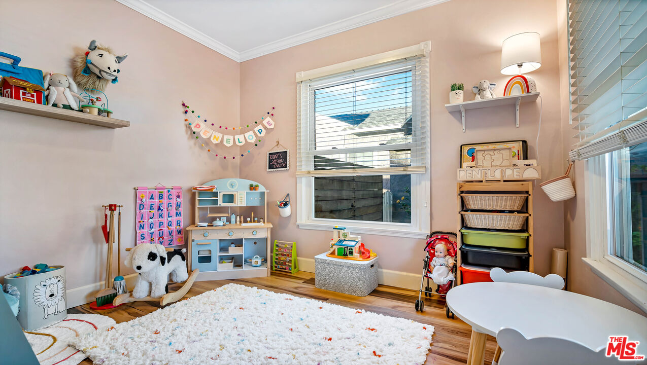 6557 Ruffner Avenue Lake Balboa, CA 91406 - Photo 15 of 31 a living room with furniture fireplace and a large window