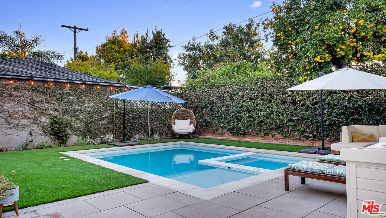 6557 Ruffner Avenue Lake Balboa, CA 91406 - Photo 19 of 31 a view of a backyard with swimming pool and sitting area